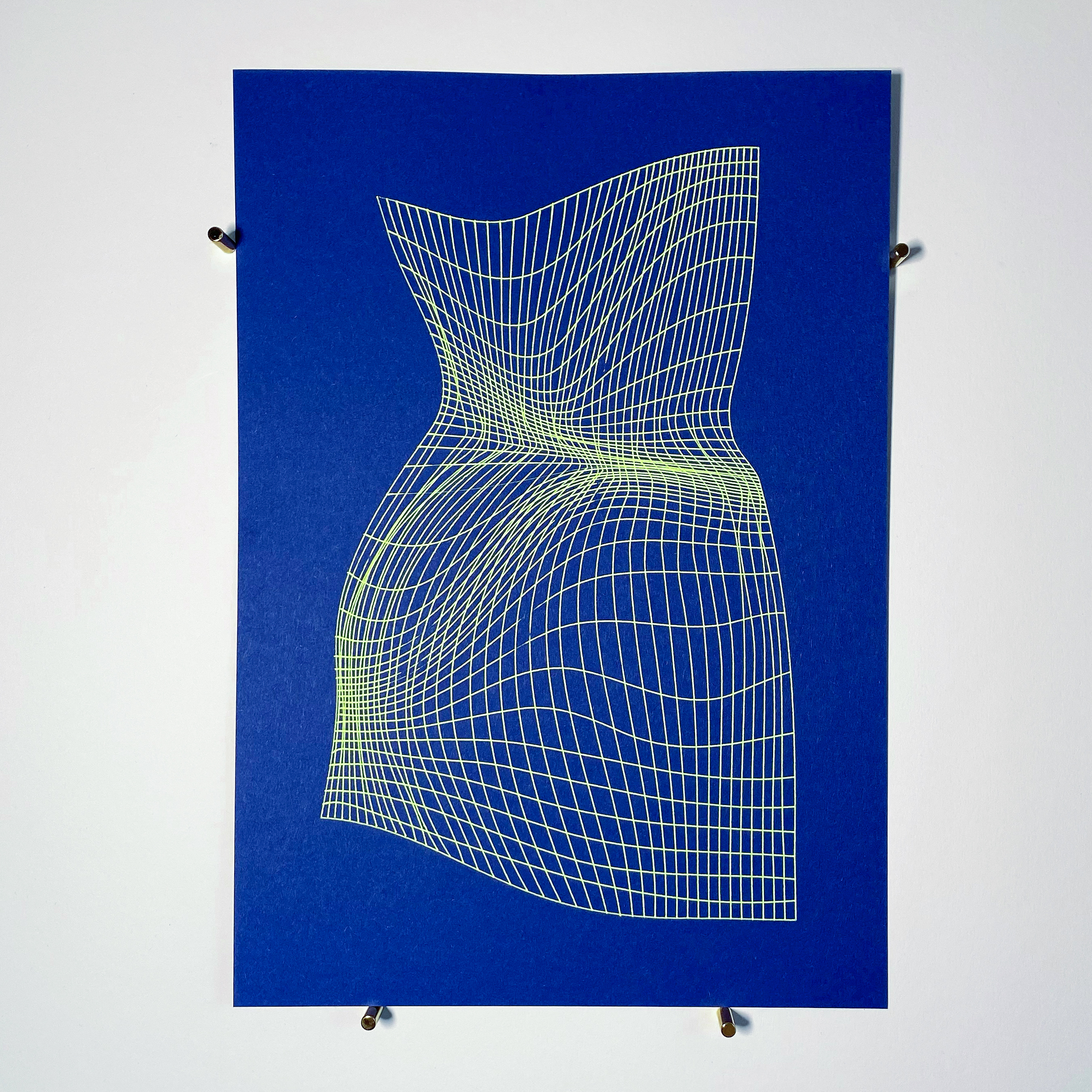 A blue paper (size: A4) with a deformed yellow grid on it.